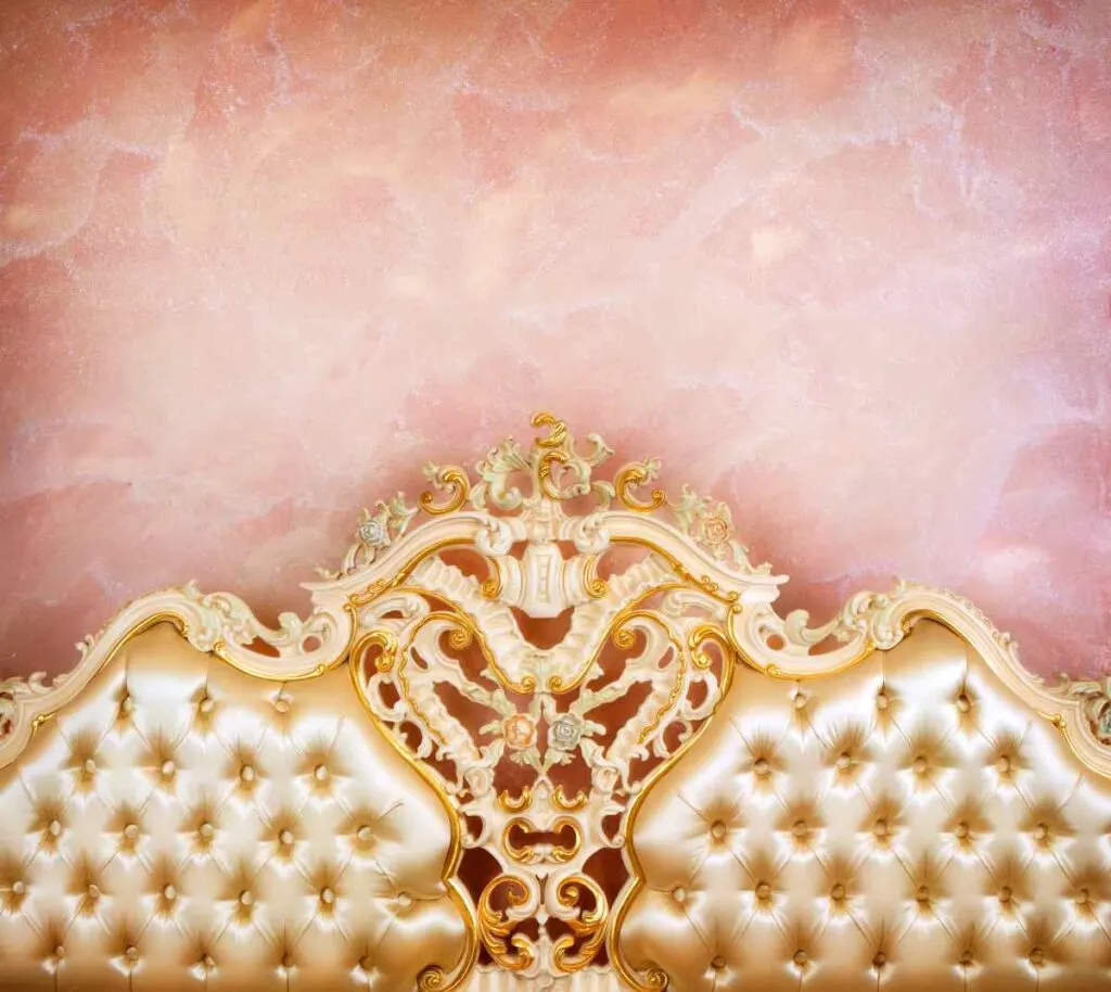 Gold tufted headboard with pink wall