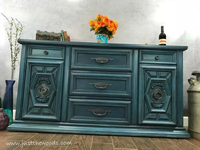 Layered-teal-paint-on-buffet