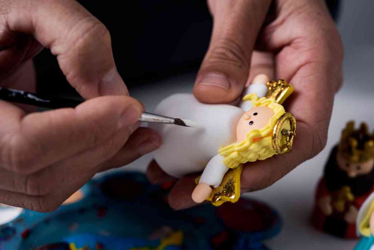 Paint-Your-Own Nativity Set person painting an angel