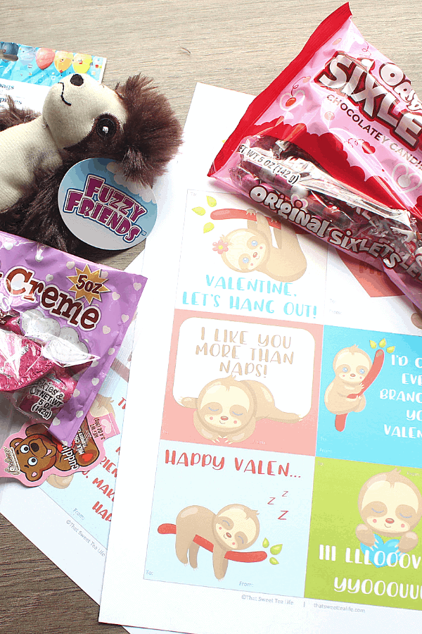 sloth valentines and candy ready to go into the goodie bags 