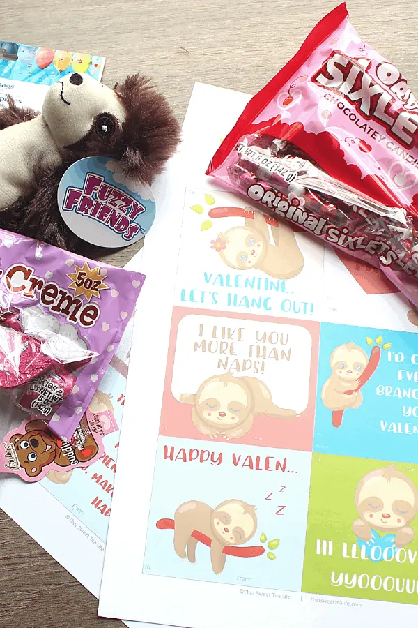 sloth valentines and candy ready to go into the goodie bags