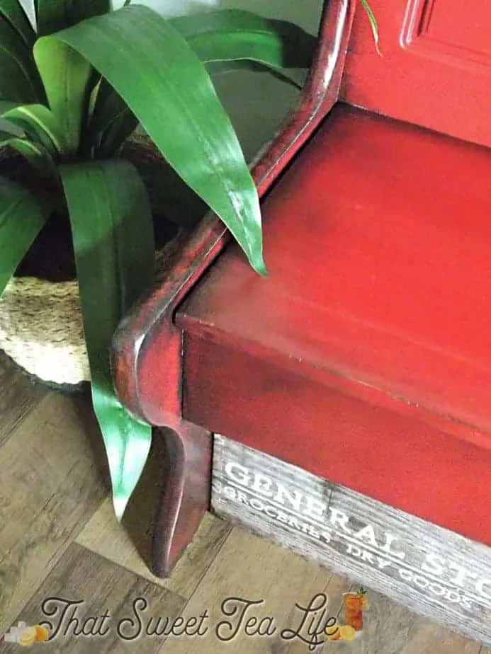 Red bench with stenciled words