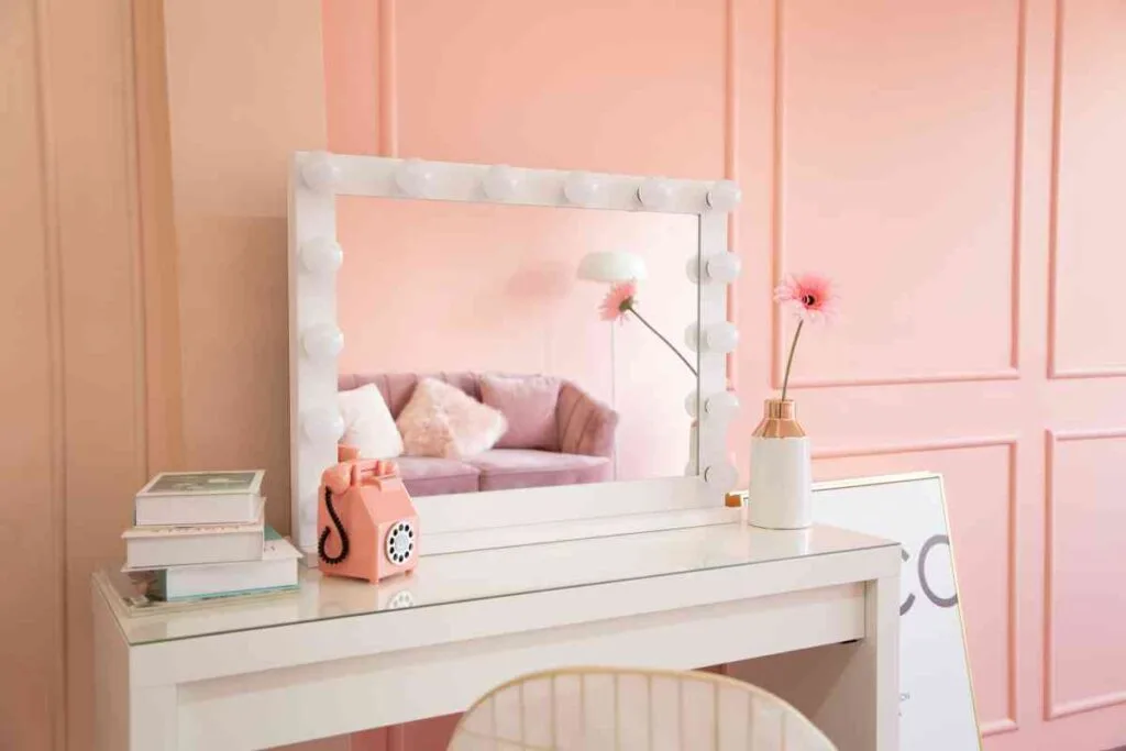 Painting a wood vanity white with pink accents