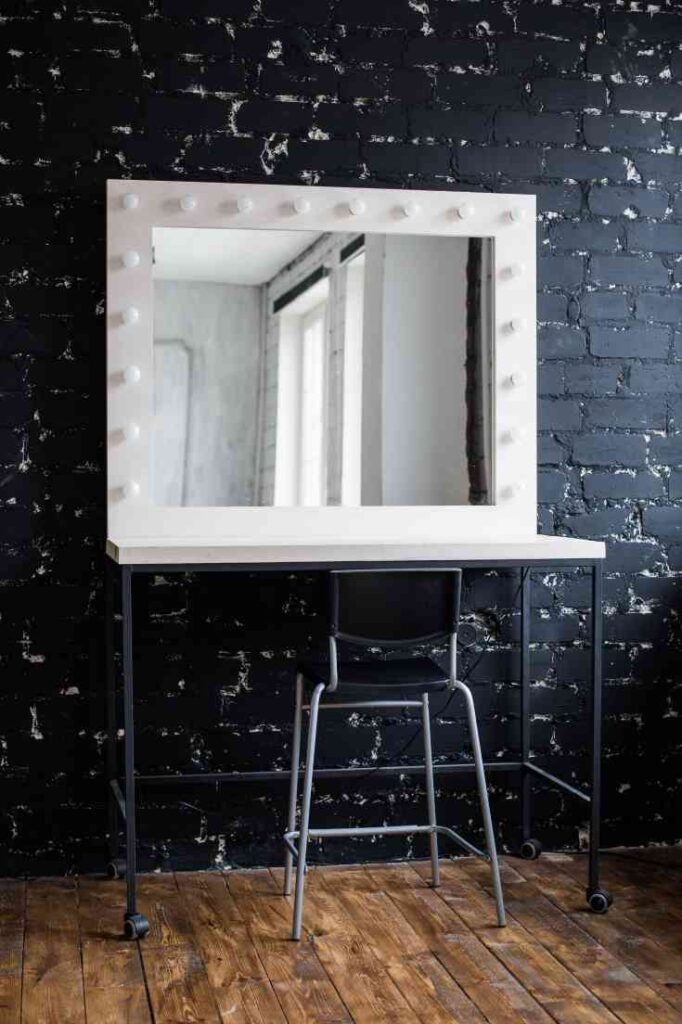 white vanity against black wall
