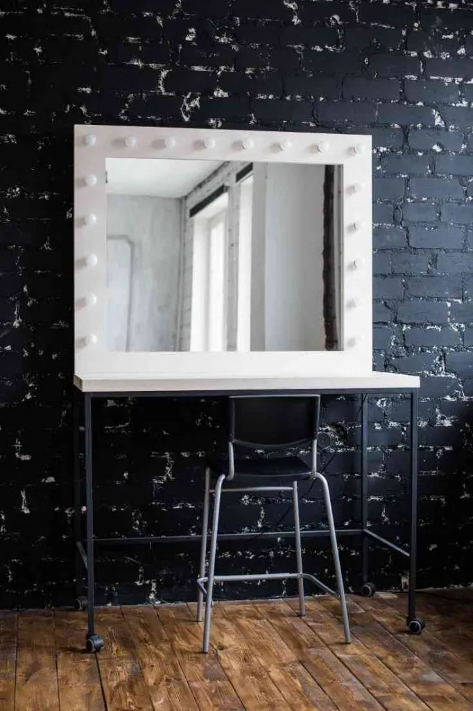 white vanity against black wall