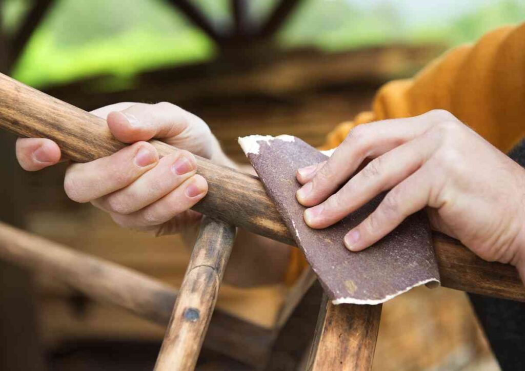 sanding furniture with sandpaper