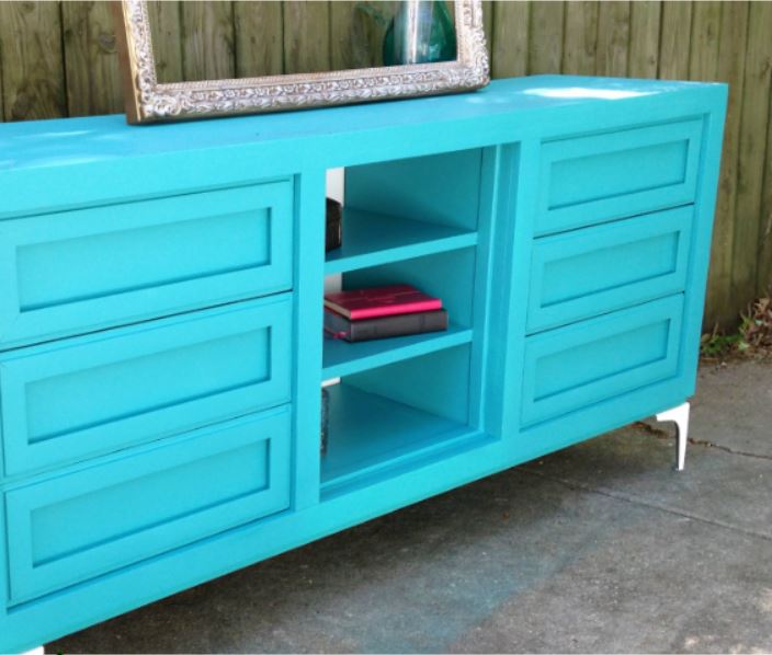 Teal dresser repurposed into a TV stand