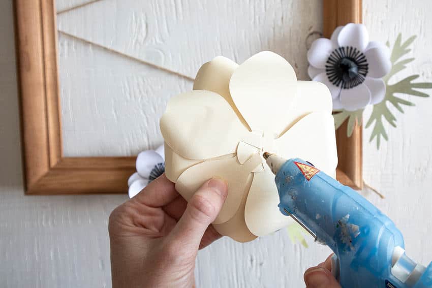 paper flowers glued to frame