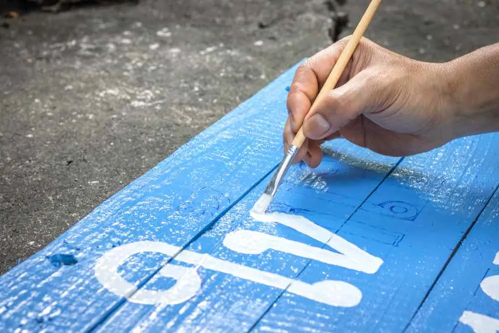 Painting a sign with acrylic paint