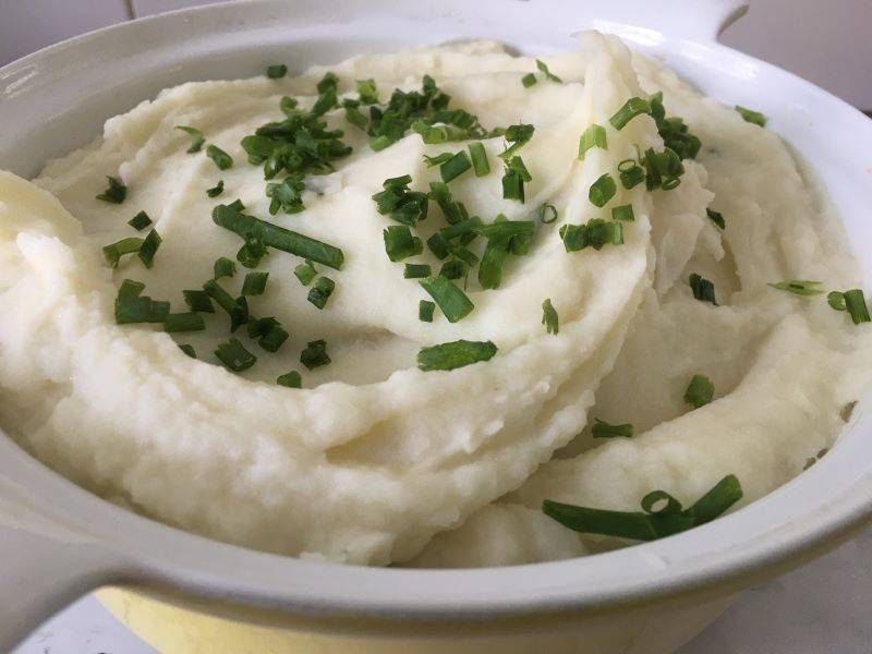 Garlic and Herb Mashed Potatoes in a yellow bowl