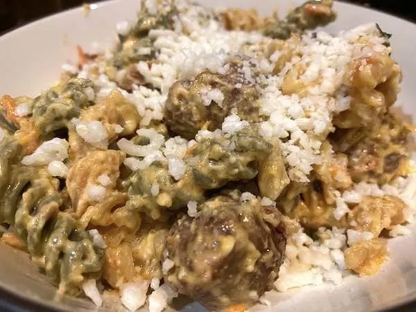 Baked Feta Pasta topped with grated cheese and ready to enjoy!