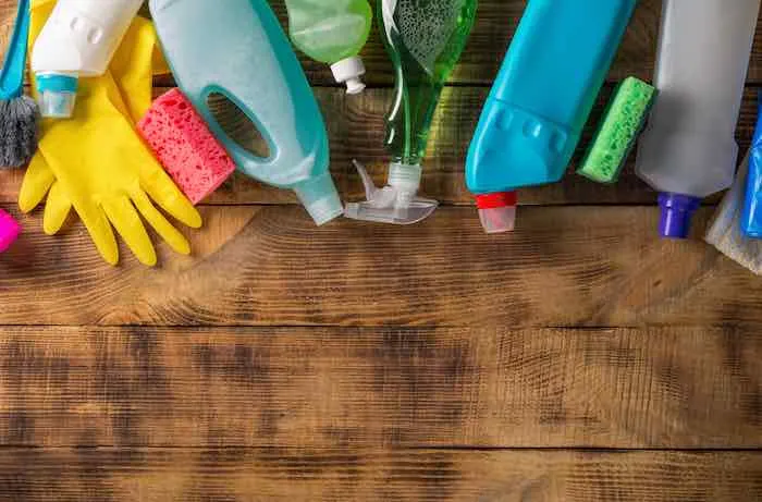 Variety of cleaning products and supplies to clean furniture before painting.