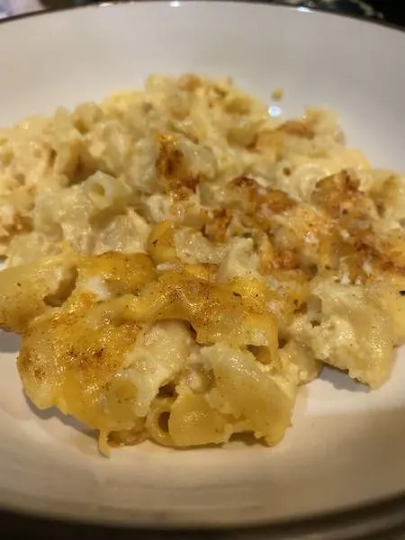 Bowl of creamy baked mac and cheese, ready to enjoy!