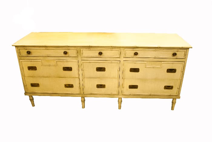A white painted dresser/sideboard with the antique patina created by applying stain over paint.