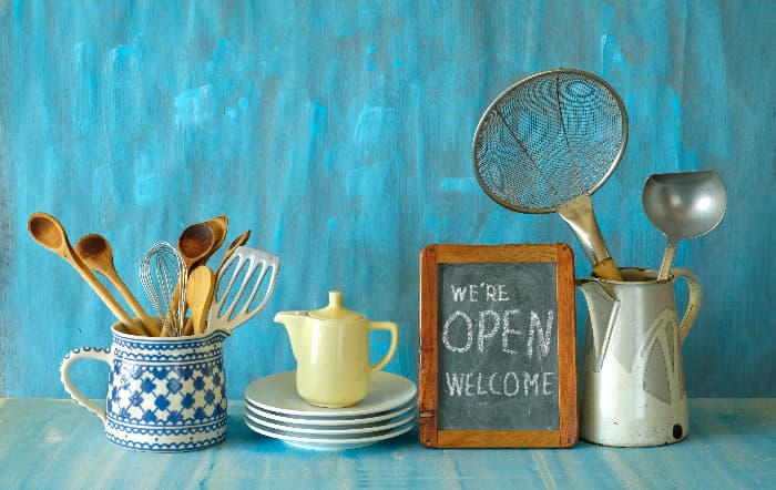 A small chalkboard farmhouse kitchen sign reading 