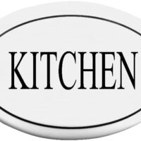 A white farmhouse kitchen sign plaque reading