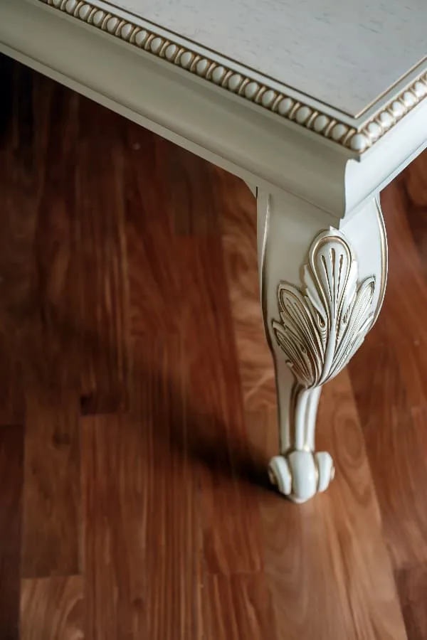 white chalk paint coffee table with gold accents