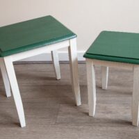 Painted tables in a green and white color scheme.