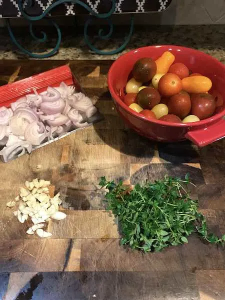 Prepared vegetables and herbs for the baked feta pasta.