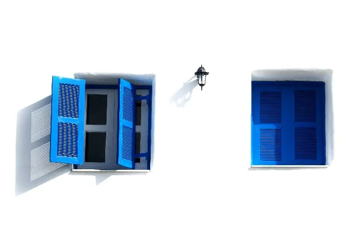 Greek-style shutters painted Royal Blue.