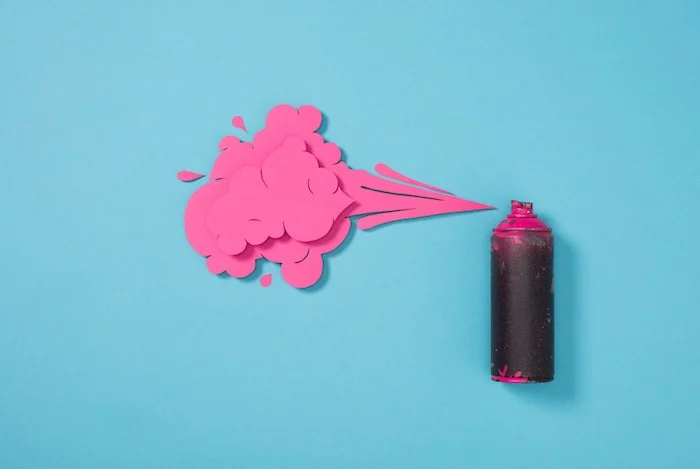 Pink can of spray paint.