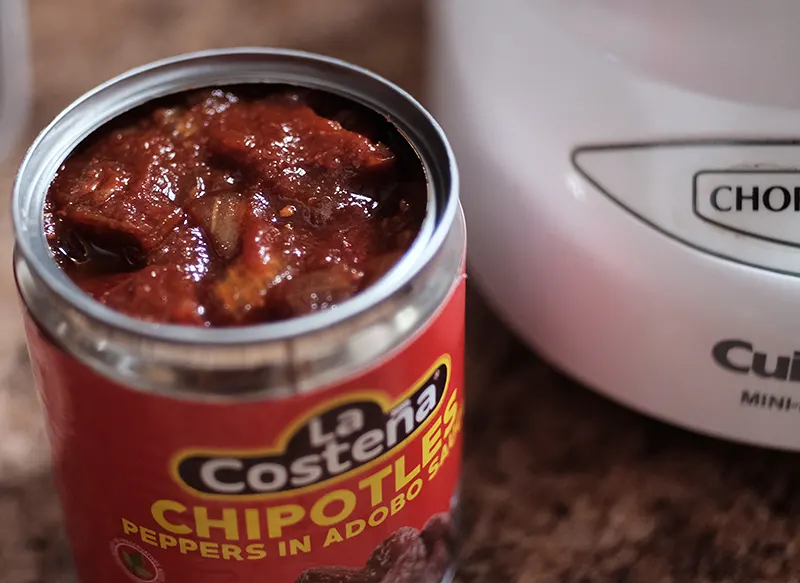 Overhead view of opened can of chipotles.