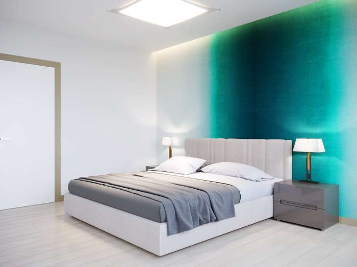 minimalist bedroom with phthalo green accent wall 