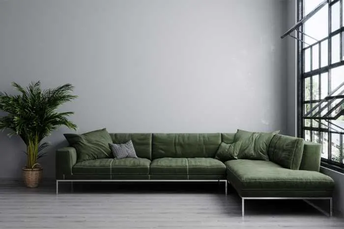 moss green sectional next large window.