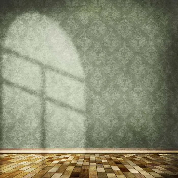 Green damask wallpaper in an empty room with tile floors