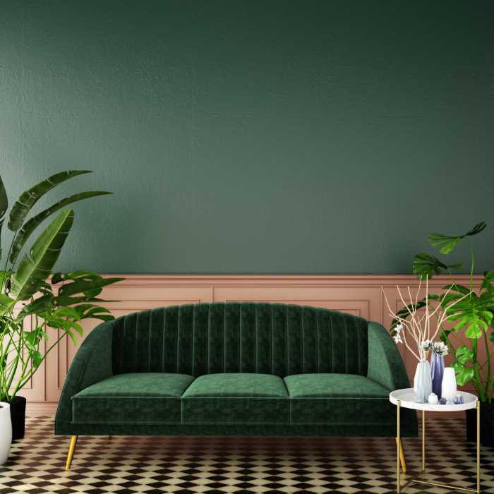 room with pink wainscoting and dark green walls above. 