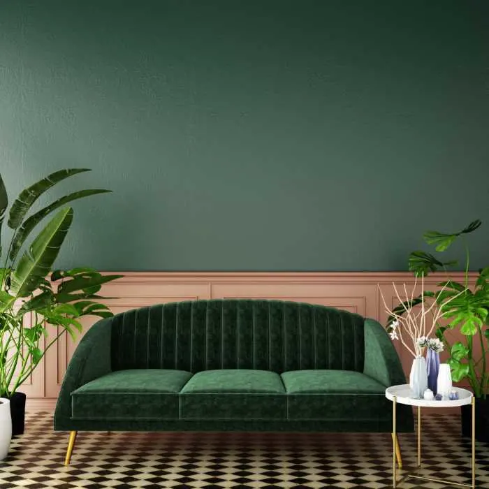 room with pink wainscoting and dark green walls above.