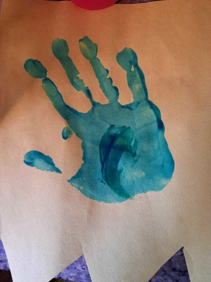 painted handprint on paper