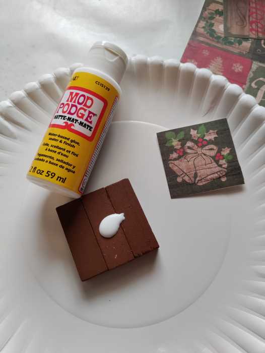 mod podge, scrapbook paper, and block ornament. 