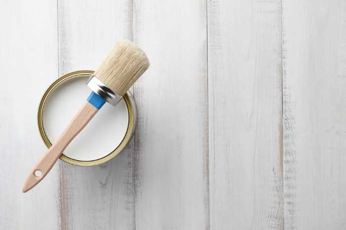 chalk paint brush on a can of white chalk paint