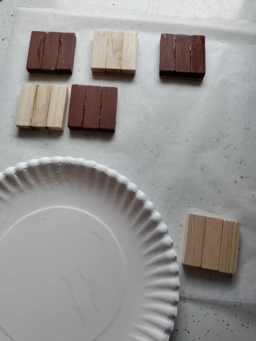 tumbling blocks glued together in groups of three to create a square.