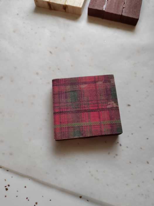 tumbling block ornament with a holiday plaid design