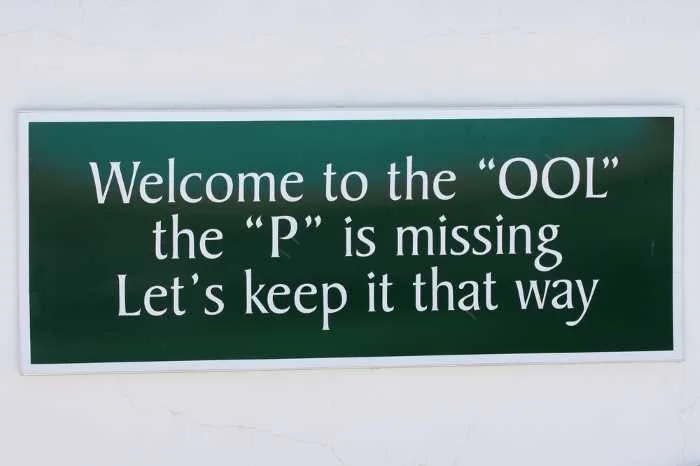 One of the funny farmhouse signs you can hang by your swimming pool.