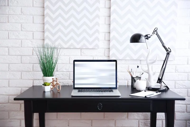 Black furniture adds a pop of contrast.