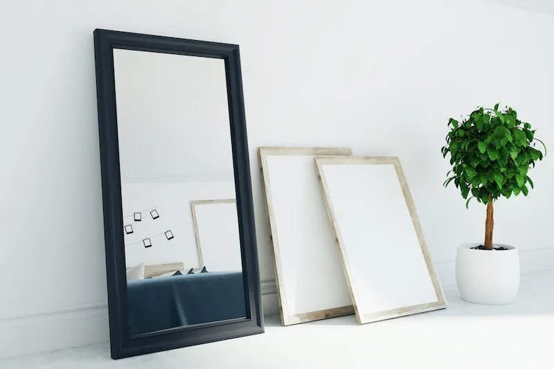Black furniture pain on a mirror.