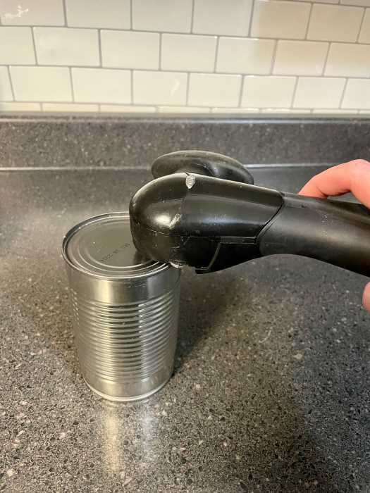 can opener designed to eliminate sharp edges. 