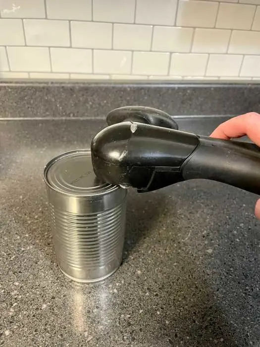 can opener designed to eliminate sharp edges.