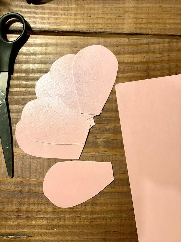 Glitter pink cardstock cutout flower petals.