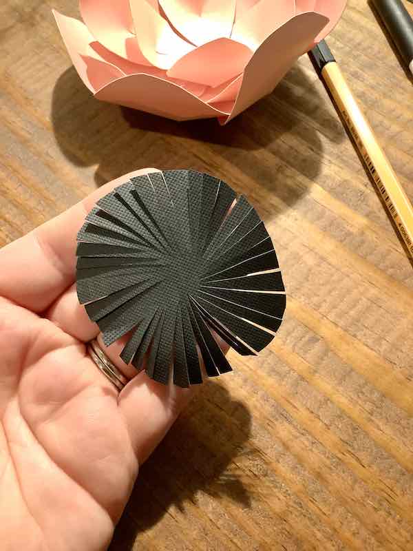 Making the center for the paper flower. 