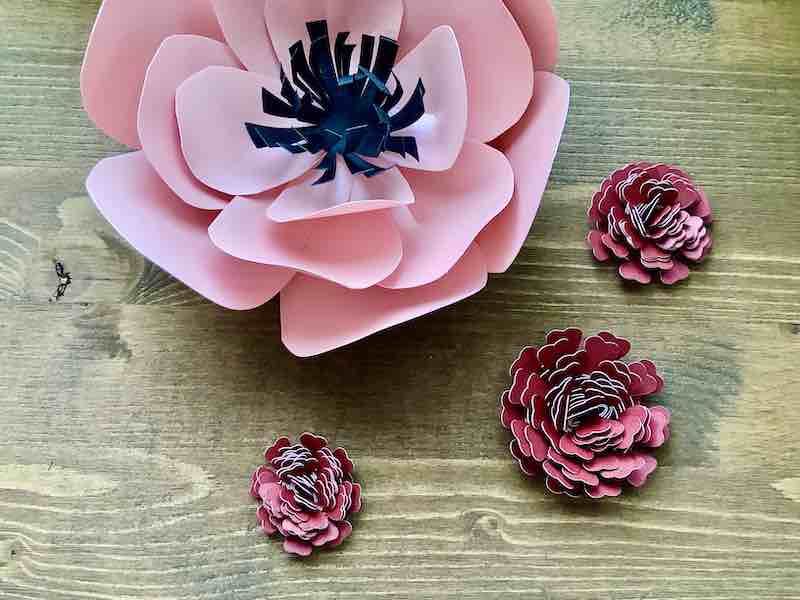 Paper Flowers on wooden table.