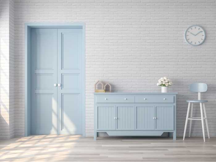 blue painted dresser in a room 