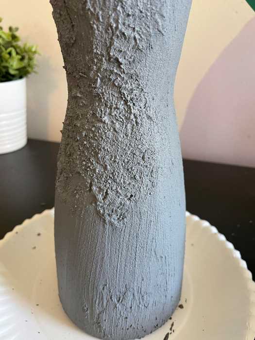 progress picture showing half of the painted glass vase stippled. 