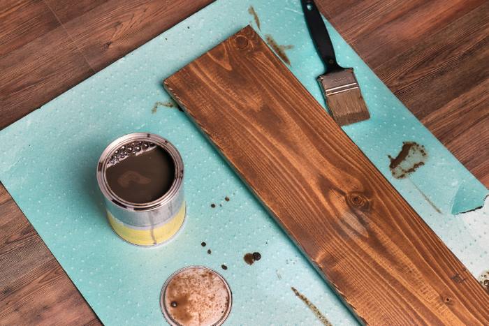Staining a piece of wood.