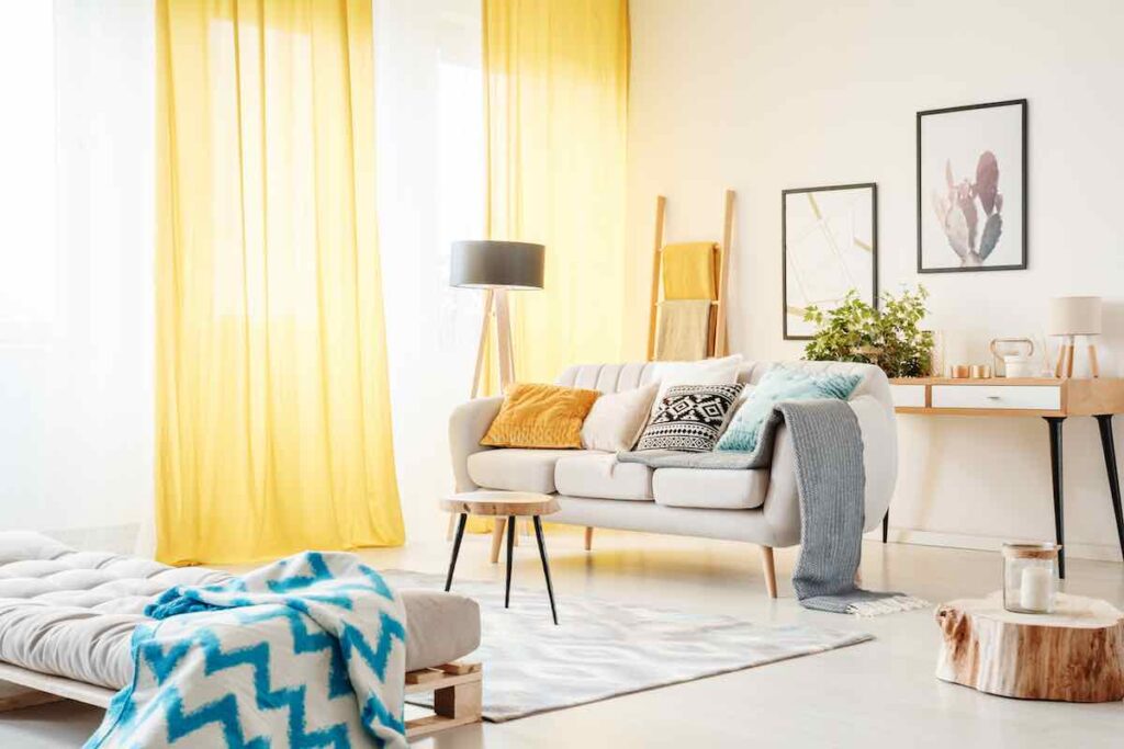 White sofa living room with yellow curtains