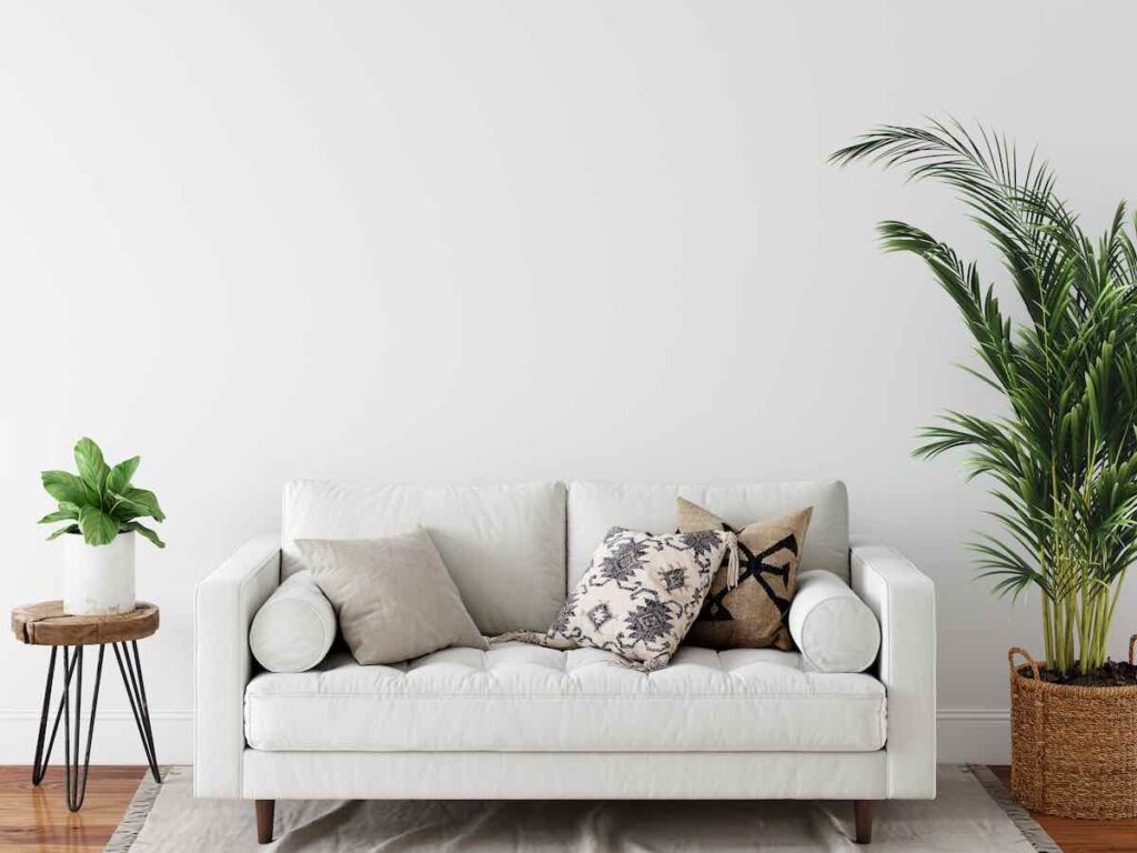 White sofa with patterned pillows