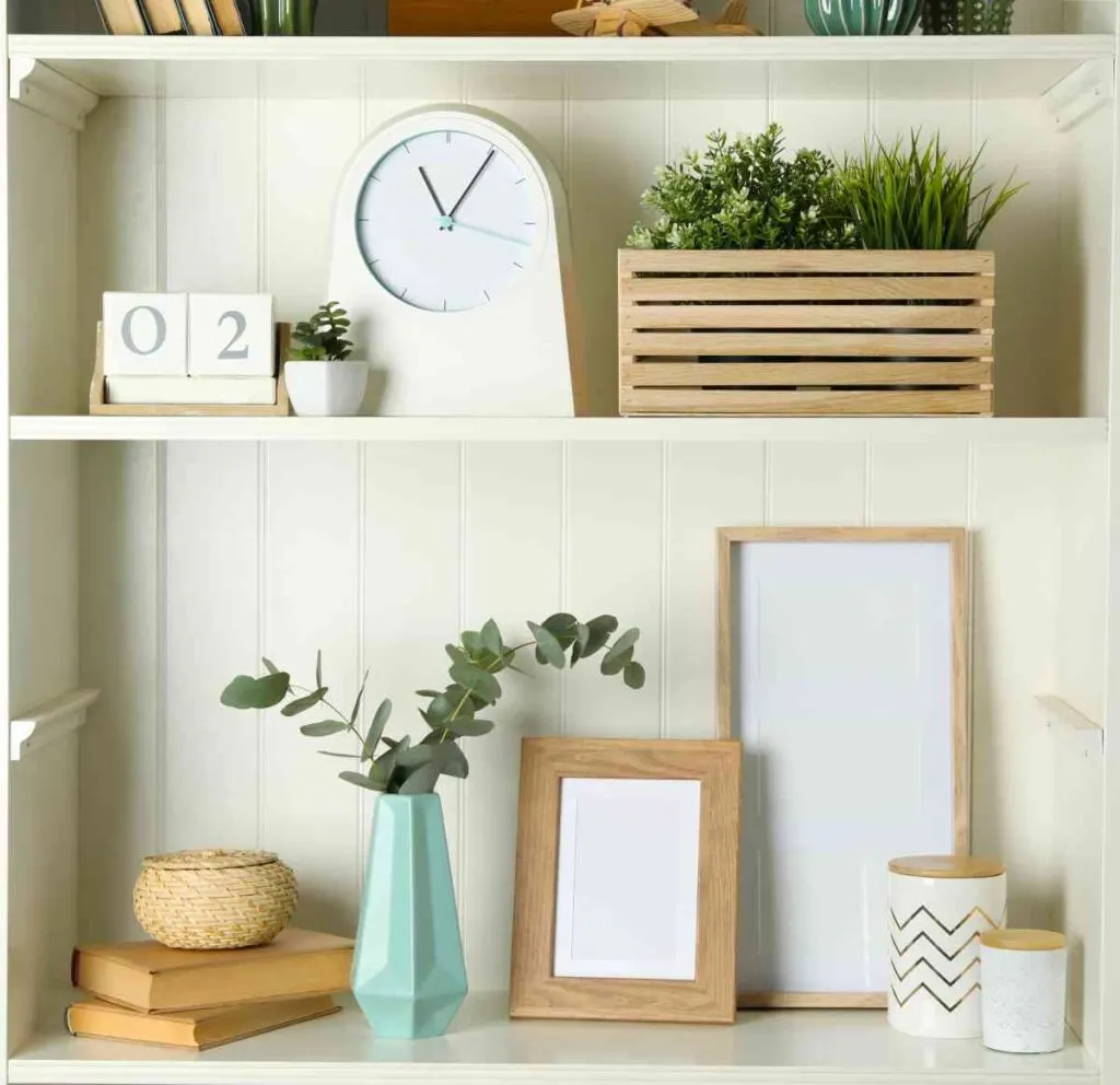 shelf decorated with frames